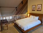 Queen bed in loft area.